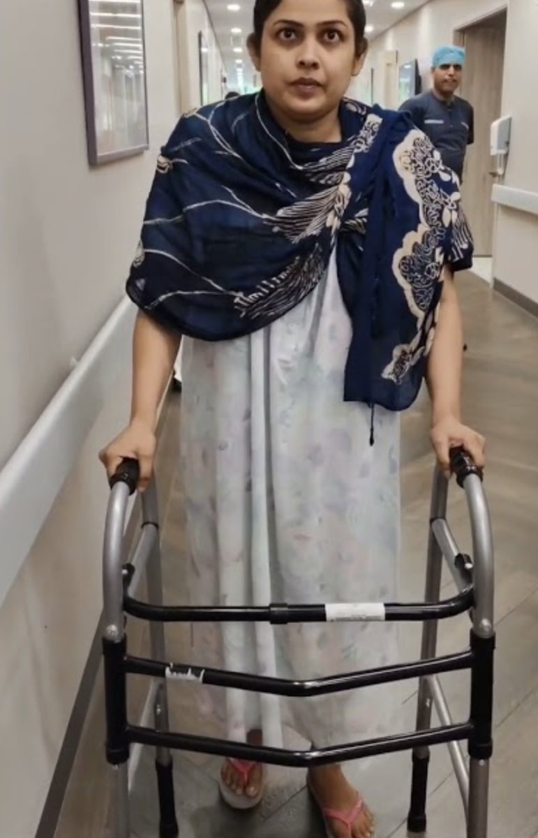 Patient walking with a frame after DAA hip replacement
