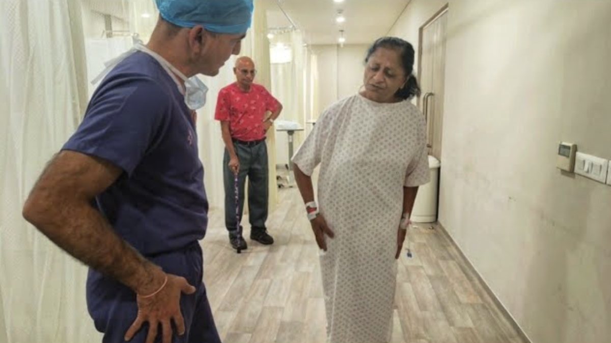 Dr. Ashwani Maichand reviewing an endoscopic spine surgery patient