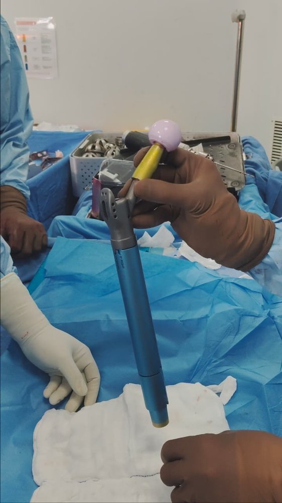 A ceramic femoral head and impactor used during minimally invasive hip replacement by Dr. Ashwani Maichand